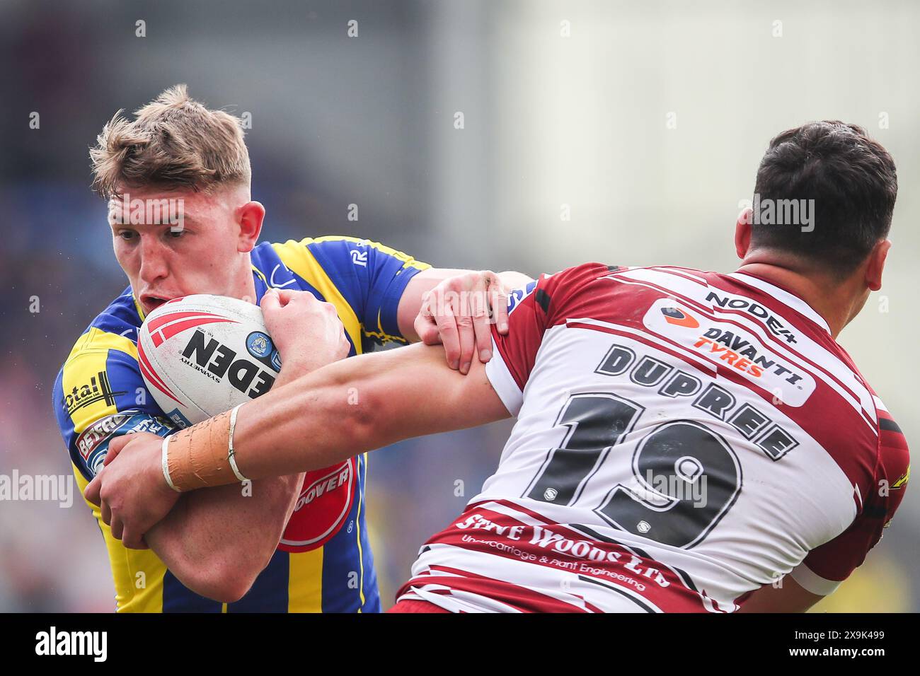 Warrington, UK. 01st June, 2024. Matty Nicholson of Warrington Wolves is tackled by Tyler Dupree of Wigan Warriors during the Betfred Super League Round 13 match Warrington Wolves vs Wigan Warriors at Halliwell Jones Stadium, Warrington, United Kingdom, 1st June 2024 (Photo by Gareth Evans/News Images) in Warrington, United Kingdom on 6/1/2024. (Photo by Gareth Evans/News Images/Sipa USA) Credit: Sipa USA/Alamy Live News Stock Photo