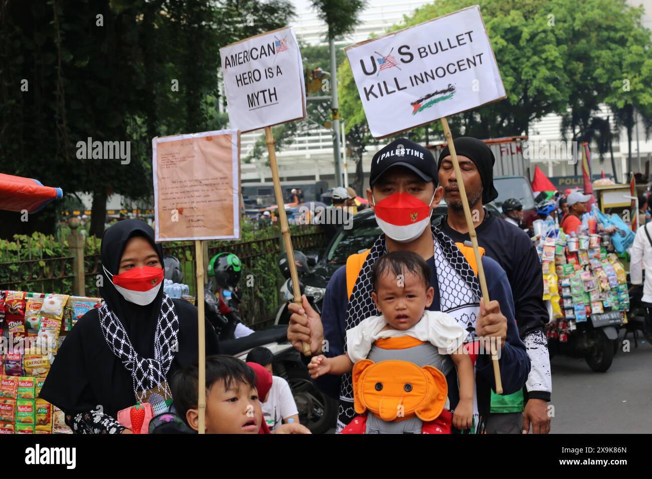 JAKARTA, INDONESIA - JUNE 1: Pro-Palestinian demonstrators, holding banners and Palestinian flags, gather outside the US Embassy to show support for Palestinians in Jakarta, Indonesia on June 1, 2024. The demonstration protested the Israeli military attack on Rafah, Gaza. Credit: Sumarno Sumarno/Alamy Live News Stock Photo