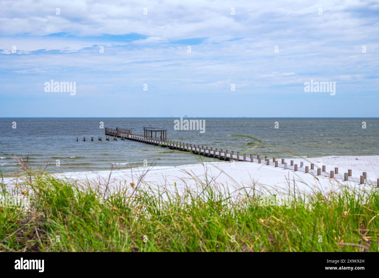 Ship Island pier and white sand beach at Gulf Islands National Seashore, Mississippi, USA. Stock Photo
