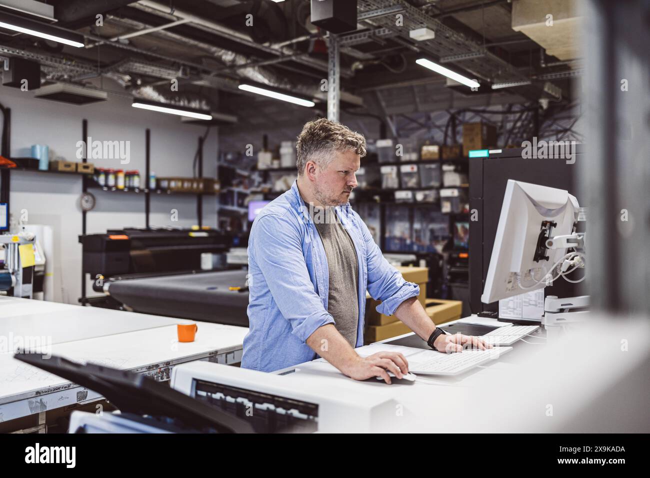 Man working in a printing factory Stock Photo
