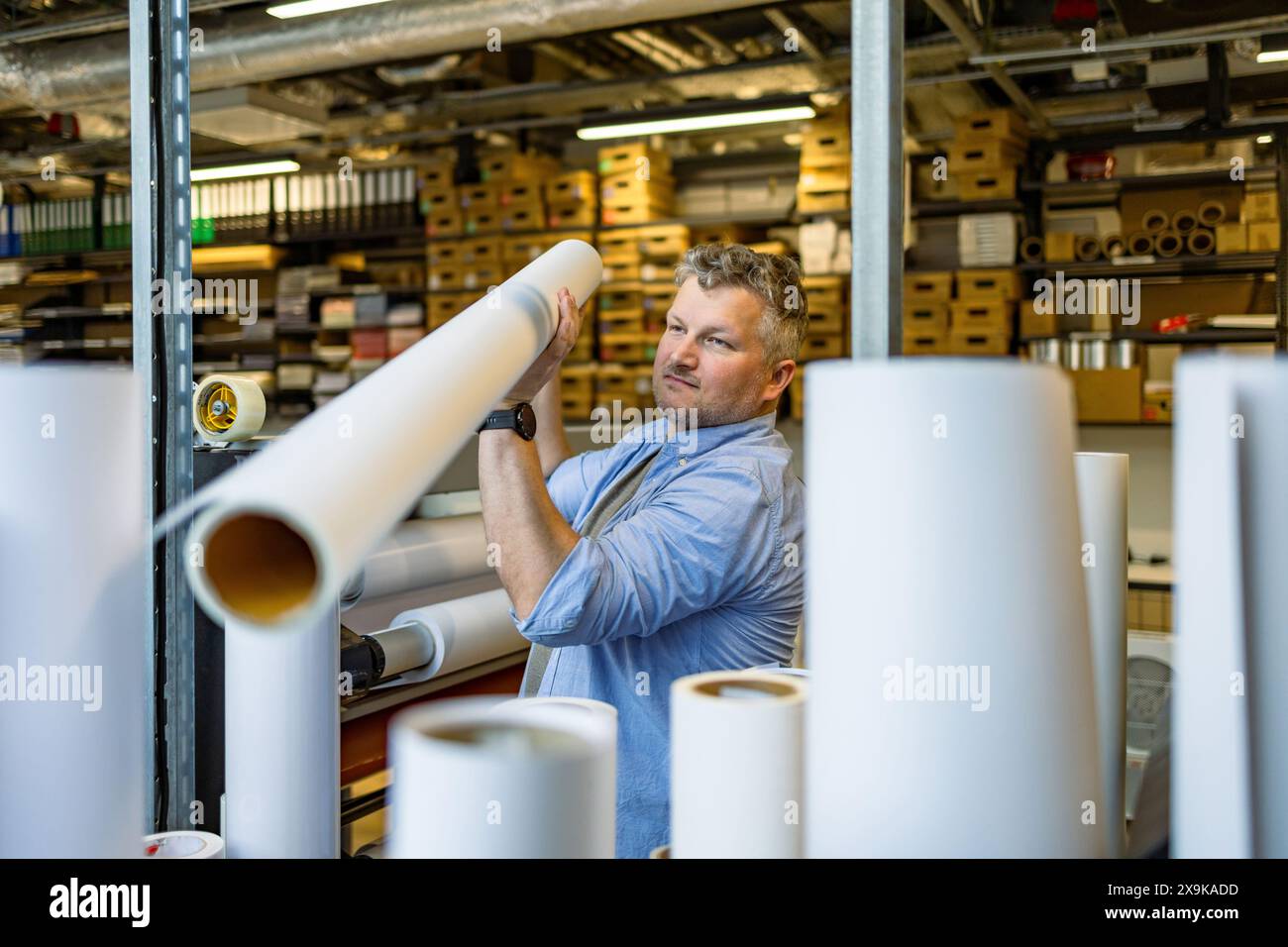 Man working in a printing factory Stock Photo