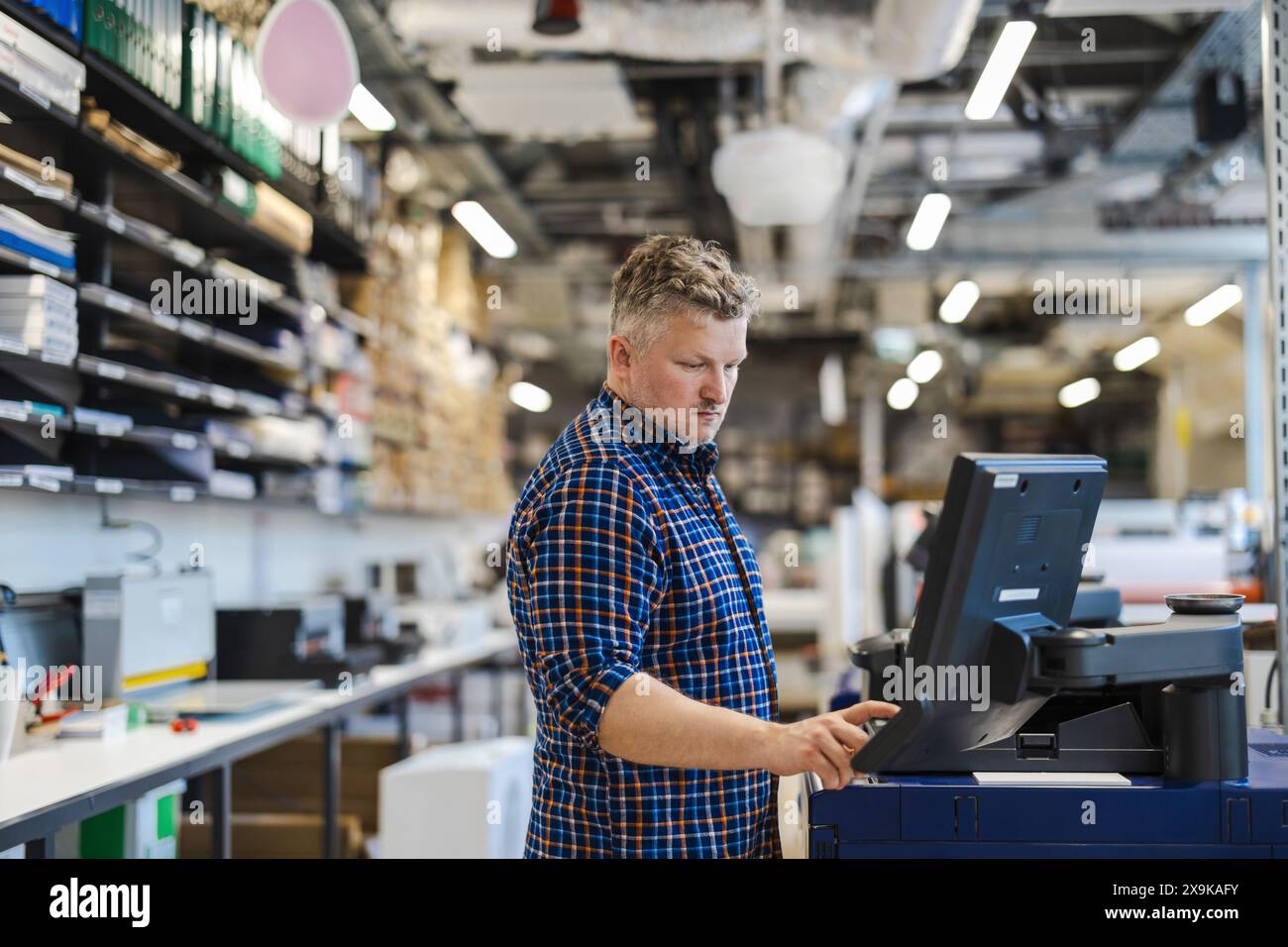 Man working in a printing factory Stock Photo