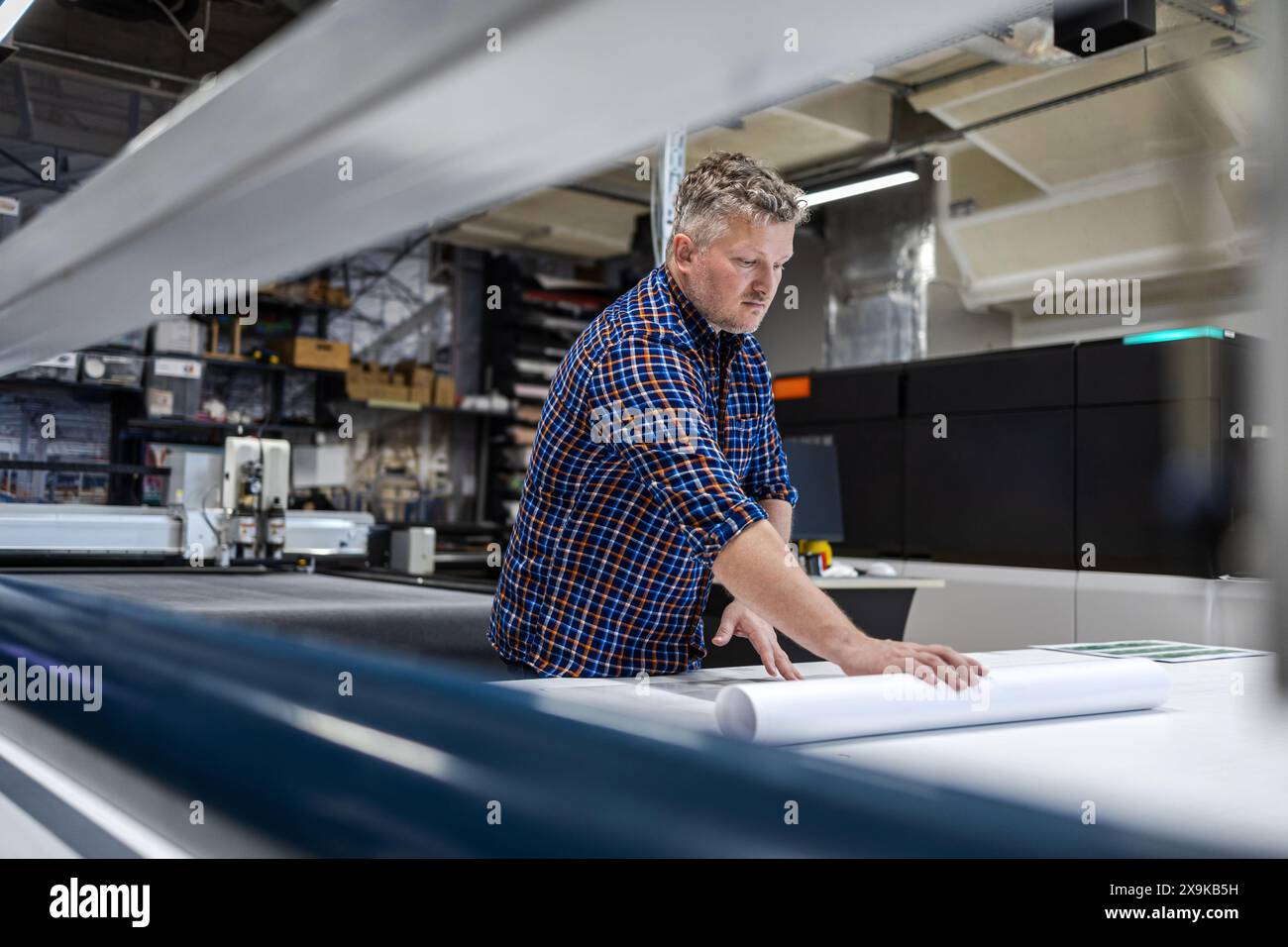 Man working in a printing factory Stock Photo