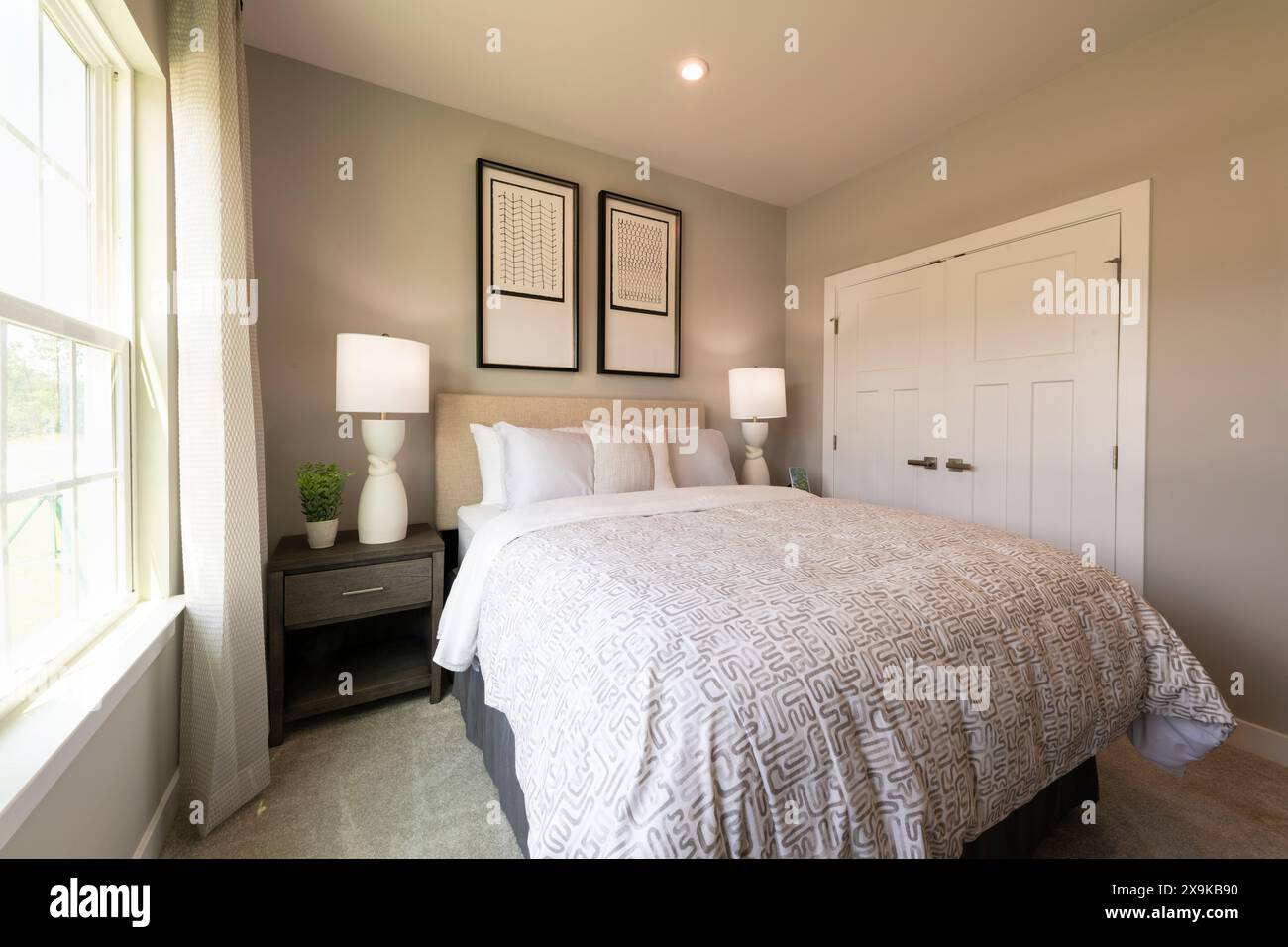 Bedroom interior. Modern bedroom design with lamps and furniture. Real ...