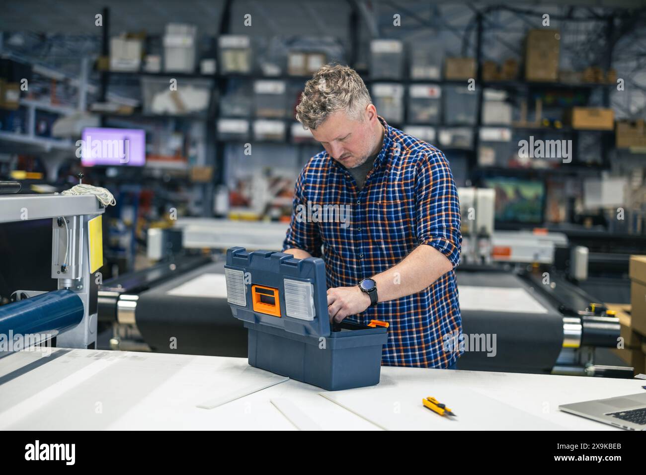 Man working in a printing factory Stock Photo