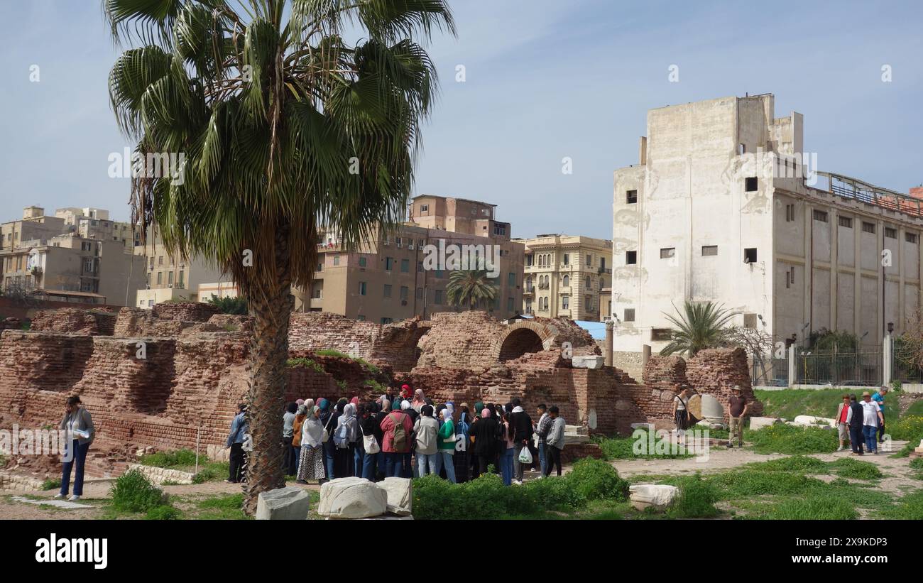 The Roman Theatre Neighborhood of  Kom el Deka in Alexandria Egypt. Muslims students Taking Lesson in the field. Stock Photo