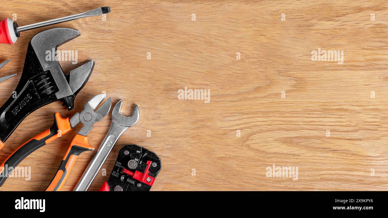 Repair tools on table. Home work desk with wooden toolkit. Top view hardware set, carpenter s tools. Business service, mechanic carpentry kit. Steel w Stock Photo