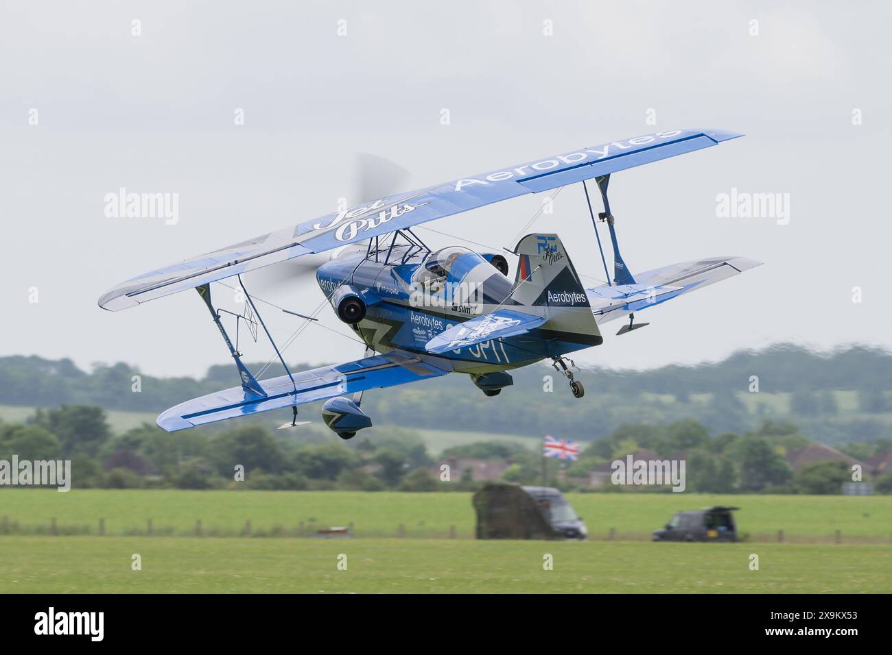Jet Pitts Muscle Biplane flown by Rich Goodwin performs a low pass