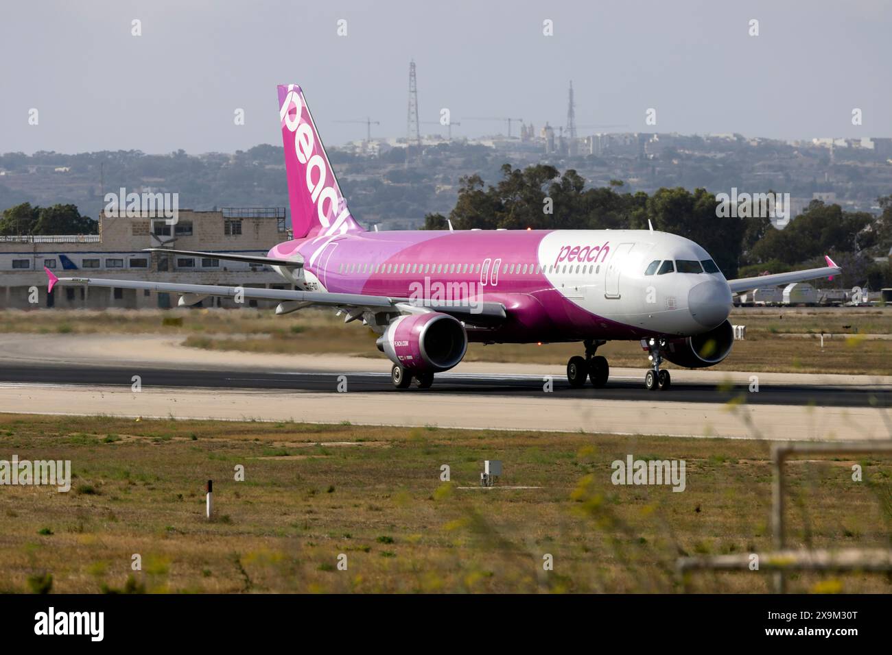 Peach airline hi-res stock photography and images - Alamy