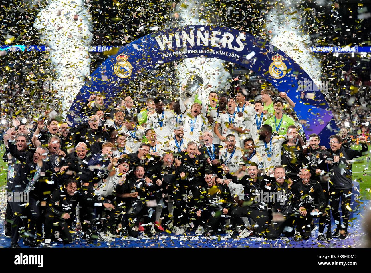 Real Madrid's Luka Modric lifts the trophy as he celebrates winning the