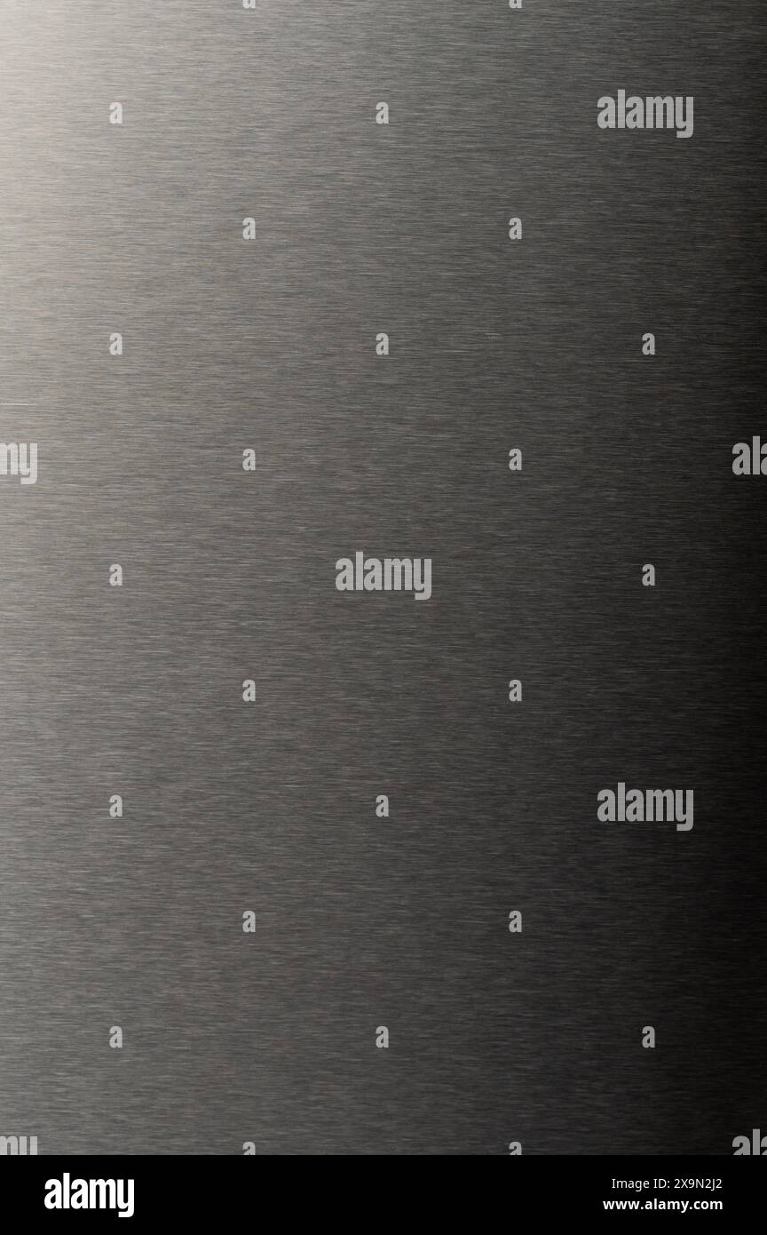 Dark gray polished metal gradient material texture macro close up view Stock Photo
