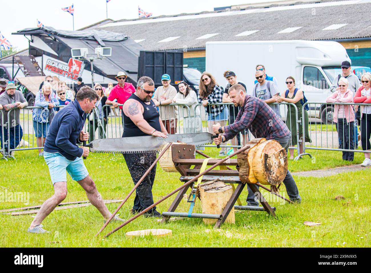 SHEPTON MALLET, SOMERSET, UK. 1st June, 2024,  Members of the poublic are given the chance to try the cross-cut saw with Dorset Axemen at the Royal Bath and West Show 2024. Credit John Rose/Alamy Live News Stock Photo
