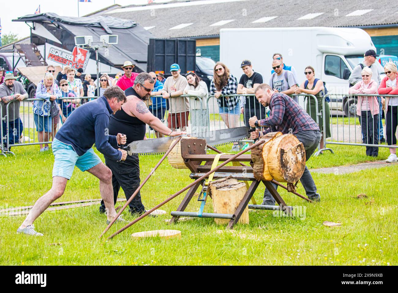 SHEPTON MALLET, SOMERSET, UK. 1st June, 2024,  Members of the poublic are given the chance to try the cross-cut saw with Dorset Axemen at the Royal Bath and West Show 2024. Credit John Rose/Alamy Live News Stock Photo