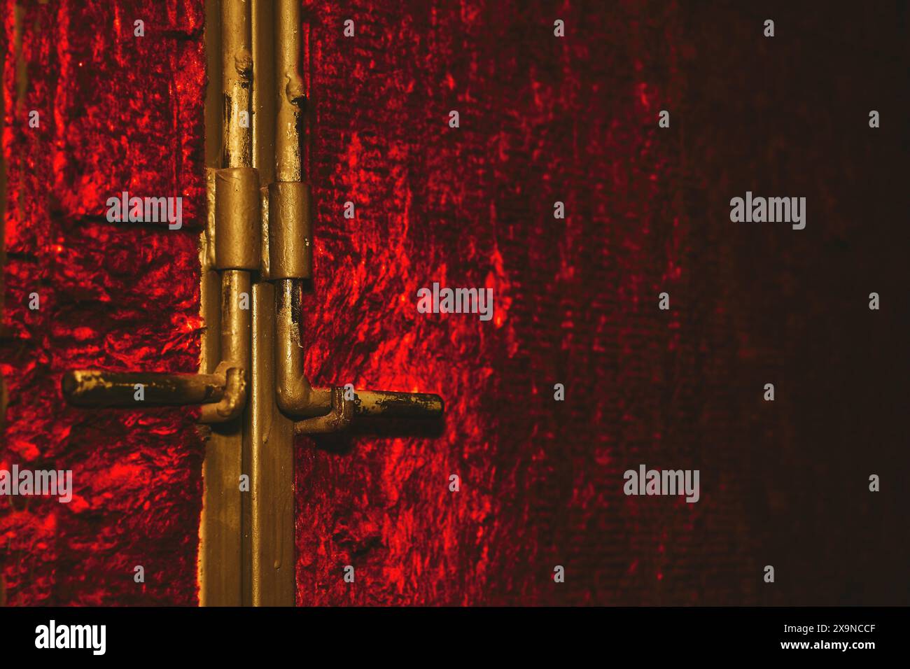 View of Metal deadbolt on a door or gate on a shining red wall Stock Photo - Alamy