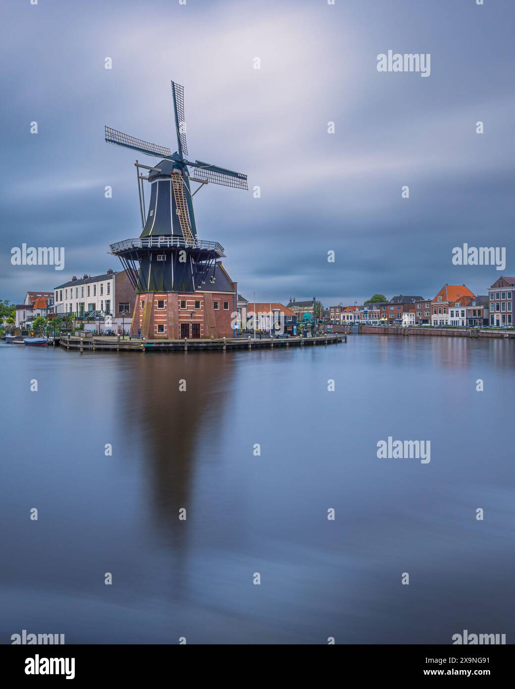 A vertical 4:5 image from an evening at Mill de Adriaan. built in 1779 as a Tras Mill, then as a Tobacco Mill and Flour Mill, before finally becoming Stock Photo
