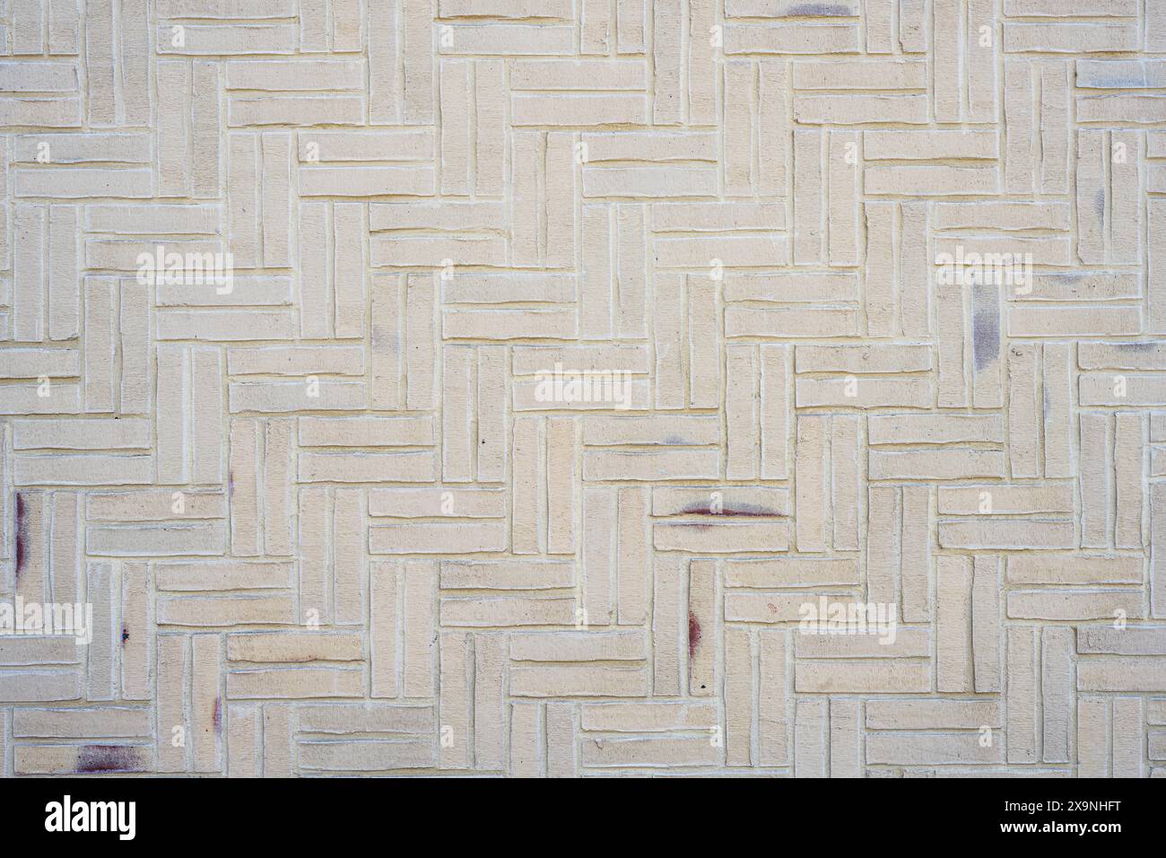Background from a wall made of small beige clinker bricks Stock Photo