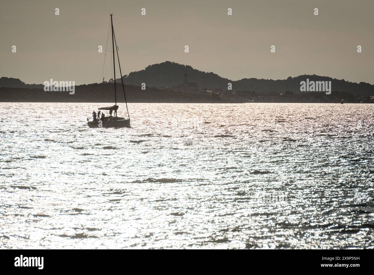 Sailing yacht at sea during sunset Stock Photo - Alamy