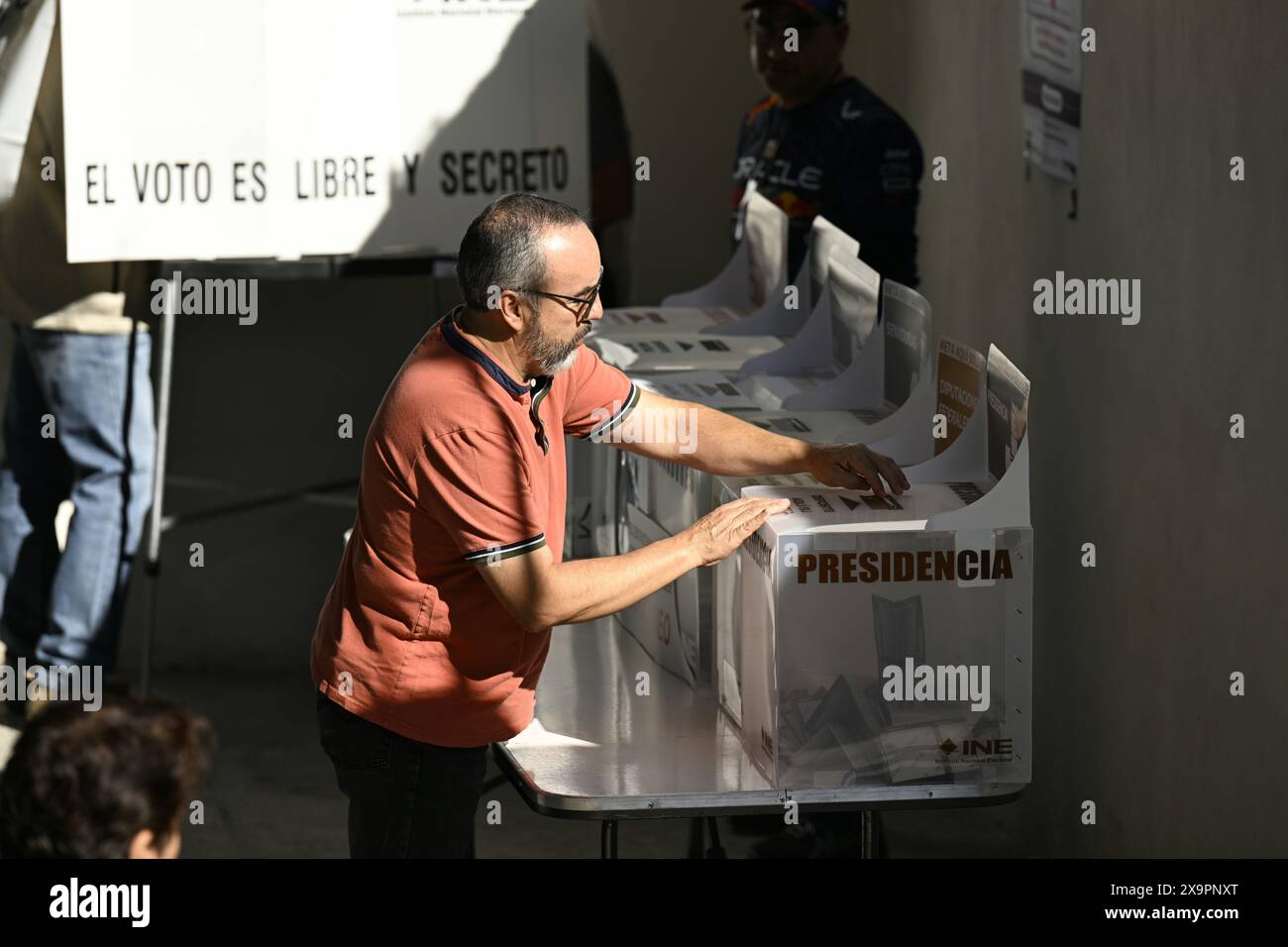 Mexico City, Mexico. 2nd June, 2024. A voter casts his ballot at a polling station in Mexico City, Mexico, June 2, 2024. Sunday's general elections are considered the largest in Mexico's modern history, with the presidency, legislative seats, governorships and local government positions up for grabs. Credit: Li Muzi/Xinhua/Alamy Live News Stock Photo