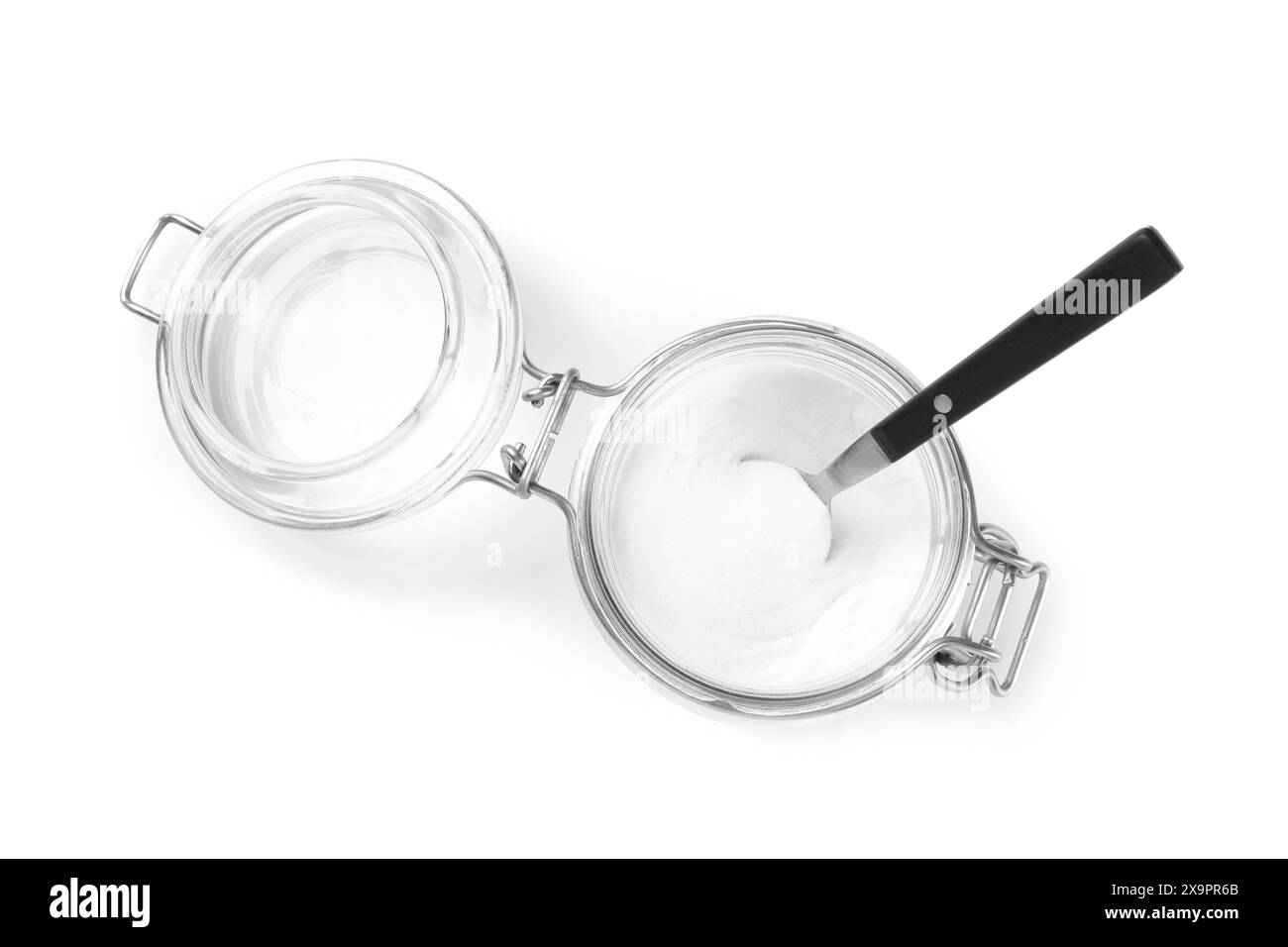 Baking soda and spoon in glass jar isolated on white, top view Stock Photo