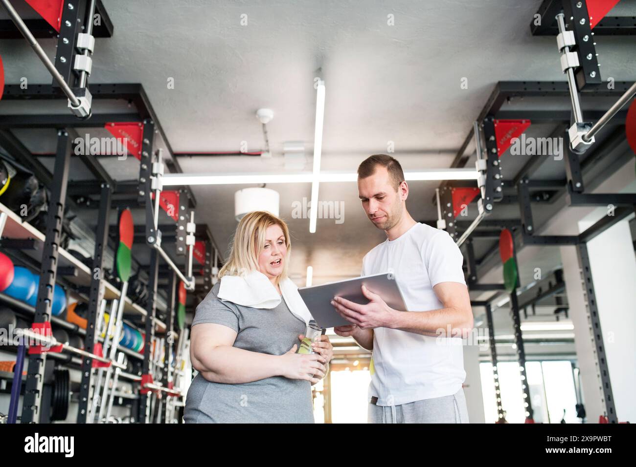 Fitness trainer discussing hi res stock photography and images Page 4 Alamy