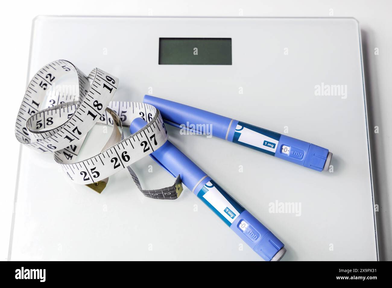 Ozempic Insulin injection pen for diabetics and weight loss. Concept of losing weight with the drug. High quality photo Stock Photo