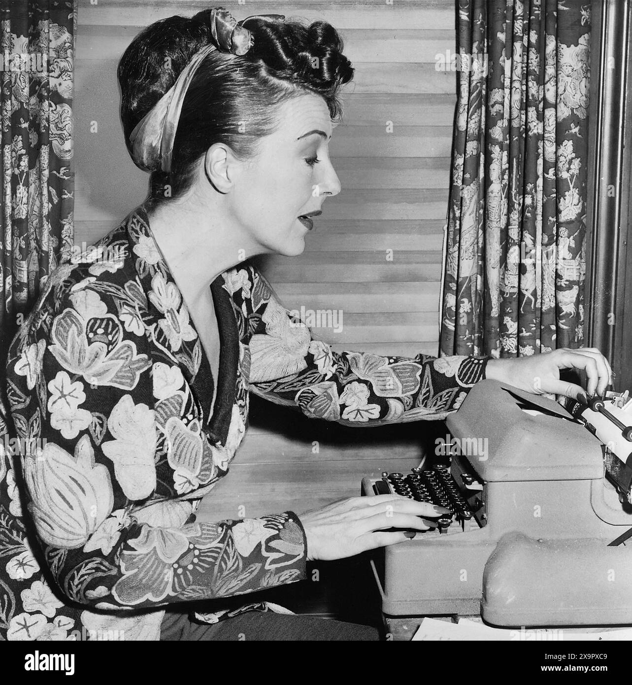 Gypsy Rose Lee, portrait, seated at typewriter, Fred Palumbo, New York World-Telegram & Sun Collection, 1956 Stock Photo