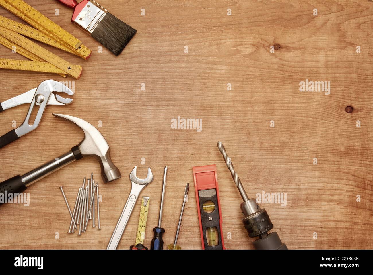 Assorted work tools on wood Stock Photo
