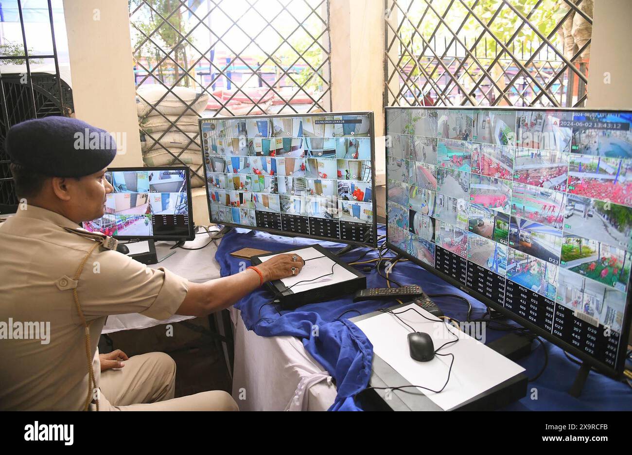 Patna, India. 02nd June, 2024. PATNA, INDIA - JUNE 2: Police personnel watching CCTV footage to monitoring strong room where Electronic Voting Machines (EVMs) kept after the seventh and last phase of Lok Sabha election at A.N. College on June 2, 2024 in Patna, India. (Photo by Santosh Kumar/Hindustan Times/Sipa USA ) Credit: Sipa USA/Alamy Live News Stock Photo