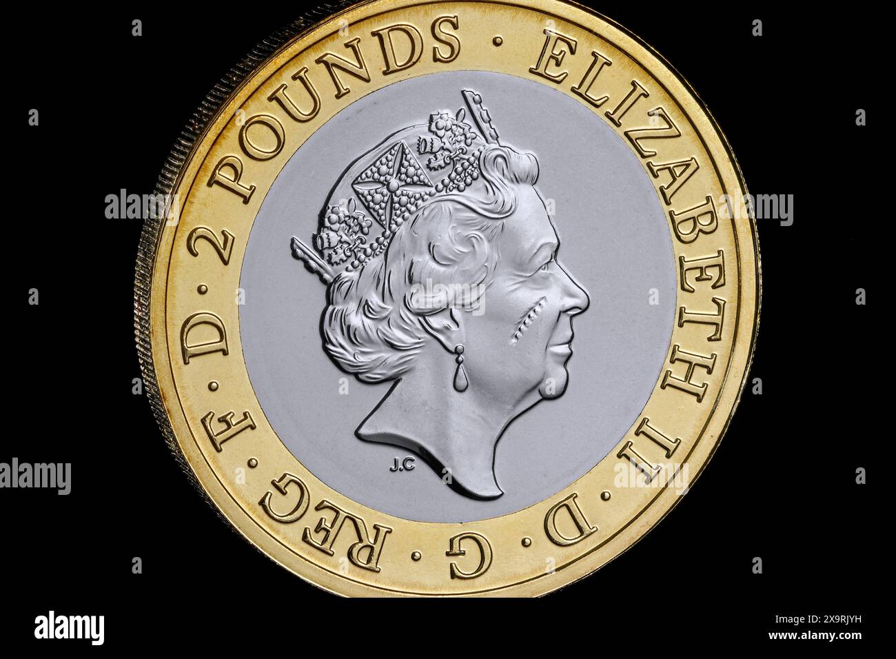 A brand new uncirculated £2 coin that appears to have damage or a ...