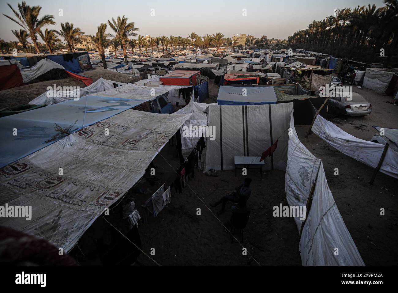 Displaced Palestinians are being seen among the tents in Deir el-Balah ...