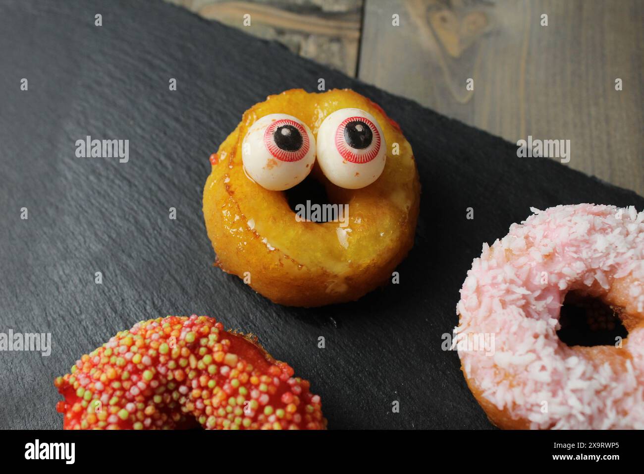 Halloween cake. Holiday treats with funny scary faces. Stock Photo