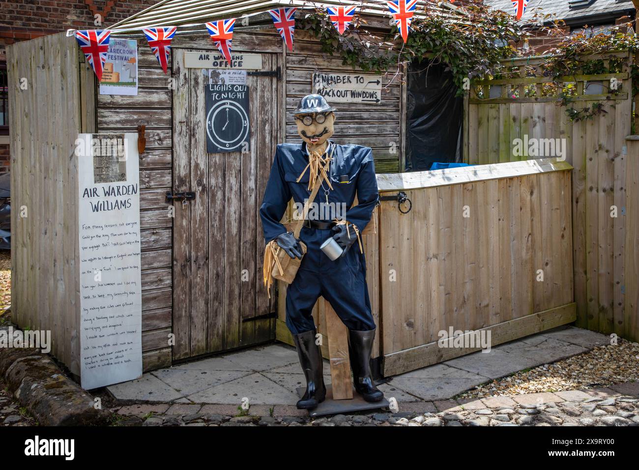 Daresbury Village, Cheshire, UK. 02nd June, 2024. Some people were not able to join up and fight in the war such as Mr Williams who was short-sighted. They helped by creating the Home Front. Here Air Warden Williams is represented by a scarecrow in the Daresbury Village Scarecrow Festival to commemorate the 80th anniversary of D-Day Credit: John Hopkins/Alamy Live News Stock Photo