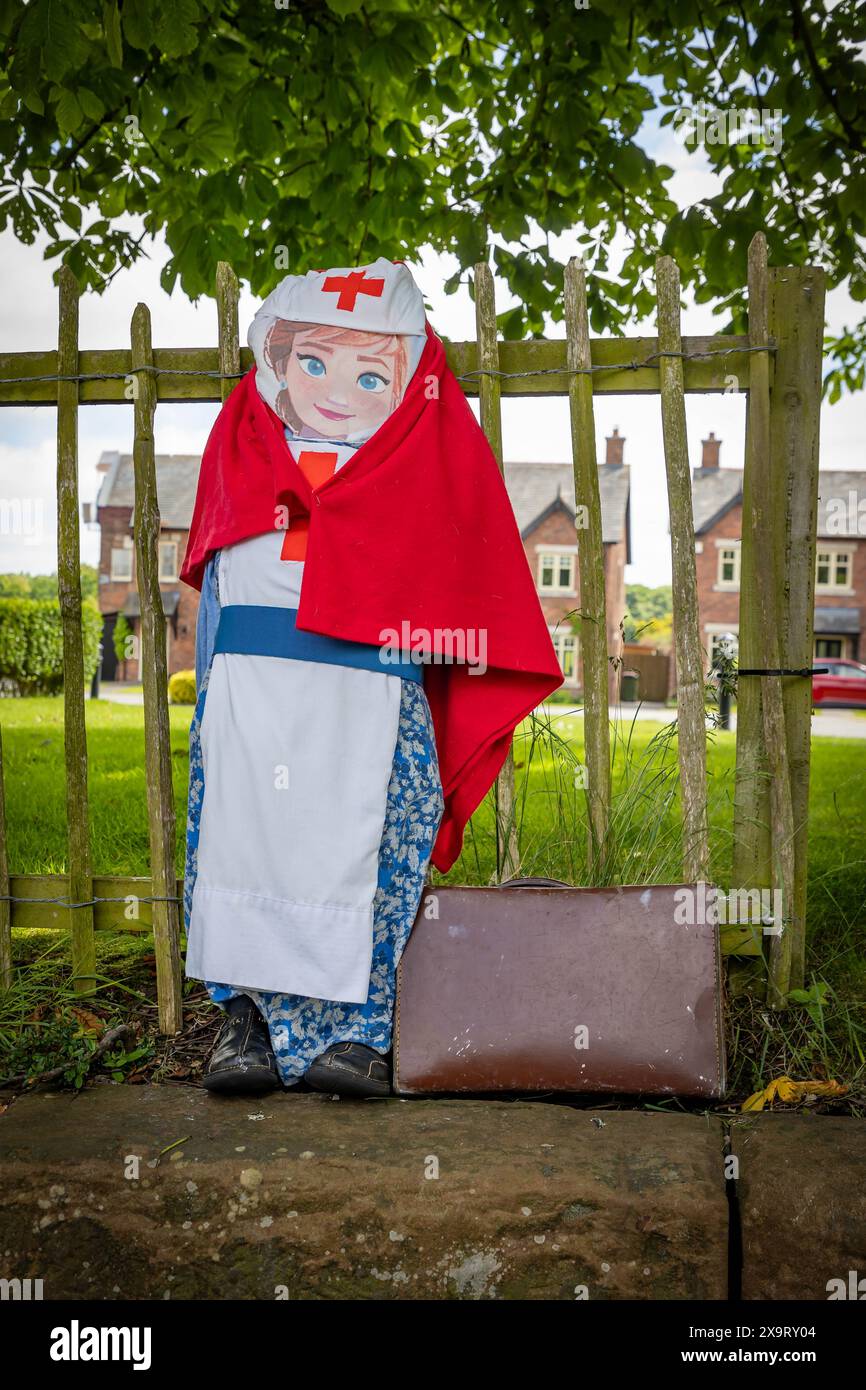 Daresbury Village, Cheshire, UK. 02nd June, 2024. About 6000 nurses served in the Army Nursing Corps during World War 2. They were part of the Queen Alexandra's Imperial Nursing Service, represented here by a scarecrow in the Daresbury Village Scarecrow Festival to commemorate the 80th anniversary of D-Day Credit: John Hopkins/Alamy Live News Stock Photo