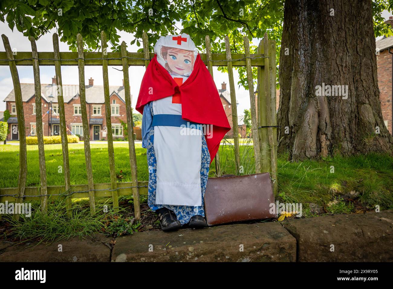 Daresbury Village, Cheshire, UK. 02nd June, 2024. About 6000 nurses served in the Army Nursing Corps during World War 2. They were part of the Queen Alexandra's Imperial Nursing Service, represented here by a scarecrow in the Daresbury Village Scarecrow Festival to commemorate the 80th anniversary of D-Day Credit: John Hopkins/Alamy Live News Stock Photo