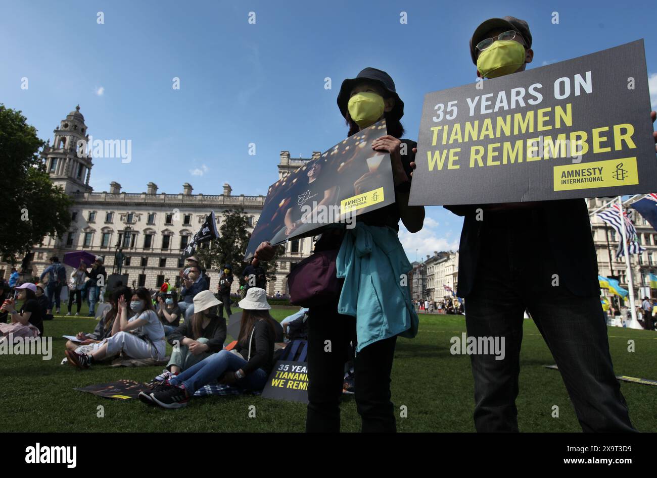 June 2, 2024, London, England, UK: A protester holds a sign saying ''˜35 Years On Tiananmen another holds a sign showing a photo of Chow Hang-Tung during the demonstration in Parliament Square. The event commemorated the1989 student-led protests and the Chinese government's bloody crackdown on 4 June, as well as protest against China's current clampdown on freedom of speech - including its increasing repression of Tibetans and Uyghurs, its crushing of dissent in Hong Kong, and the intimidation of Chinese and Hong Kong students in the UK, Europe and North America. Thirty-five years on, the Chin Stock Photo