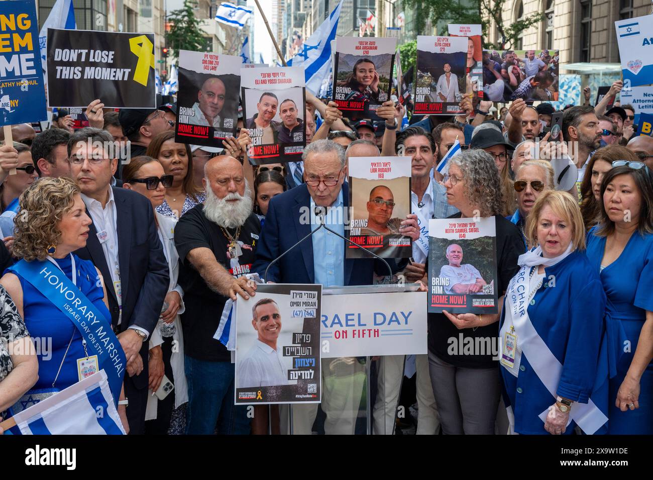 NEW YORK, NEW YORK - JUNE 02: Senate Majority Leader, U.S. Senator Chuck Schumer (C) speaks to media at the start the annual Celebrate Israel Parade on June 2, 2024 in New York City. Tens of thousands of people marched up Fifth Avenue during a parade for Israel, with many calling for the release of hostages held by Hamas in Gaza, 'Bring Them Home,' a message that rang loud and clear. The parade came almost eight months after the unprecedented Oct. 7 attack by Hamas, the deadliest in Israel's history. The NYPD increased security for the parade due to tensions and protests surrounding the war i Stock Photo