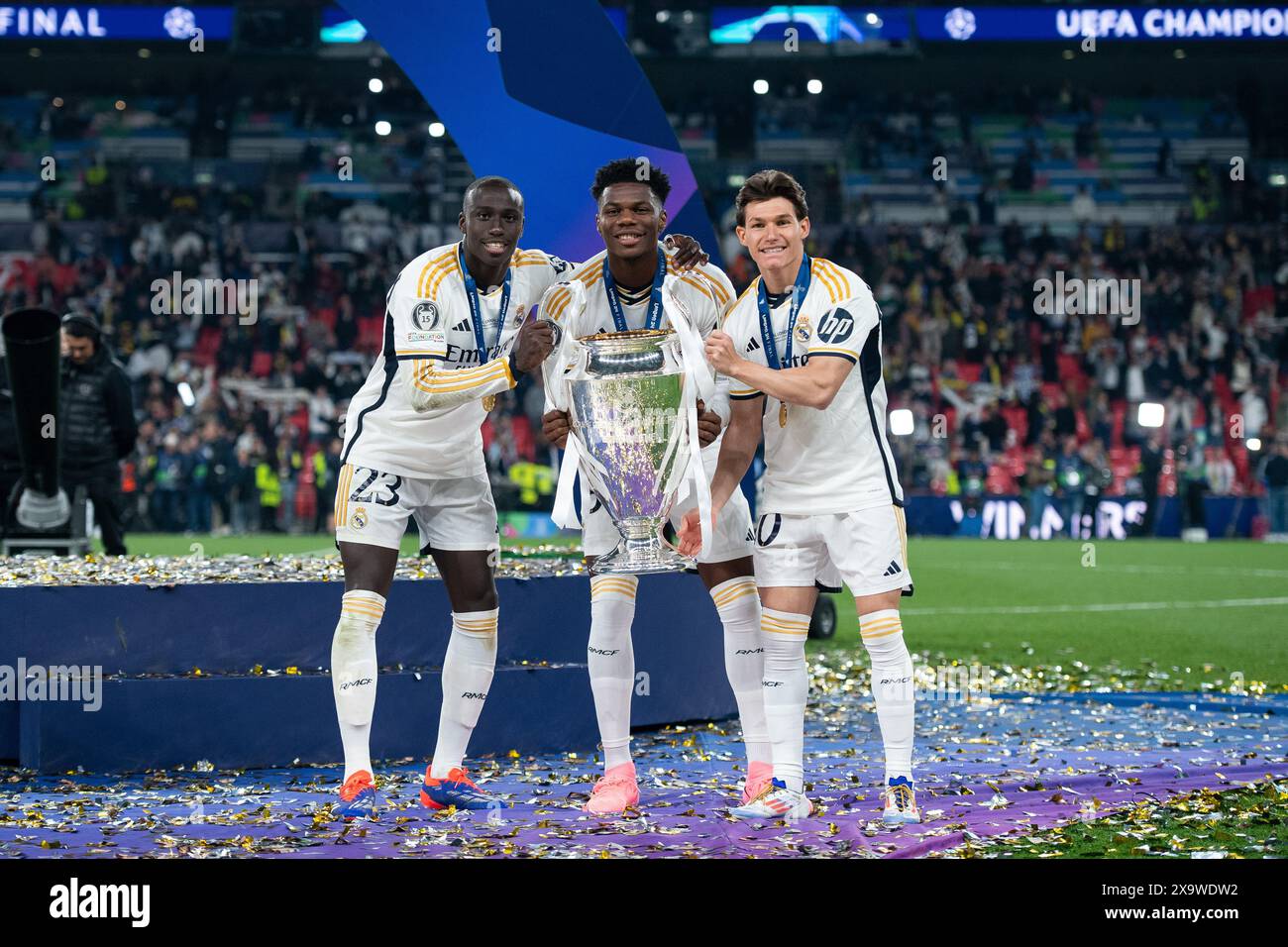 LONDON, ENGLAND - JUNE 1: Ferland Mendy, Aurelien Tchouameni and Fran Garcia of Real Madrid celebrate with UEFA Champions League trophy after winning Stock Photo