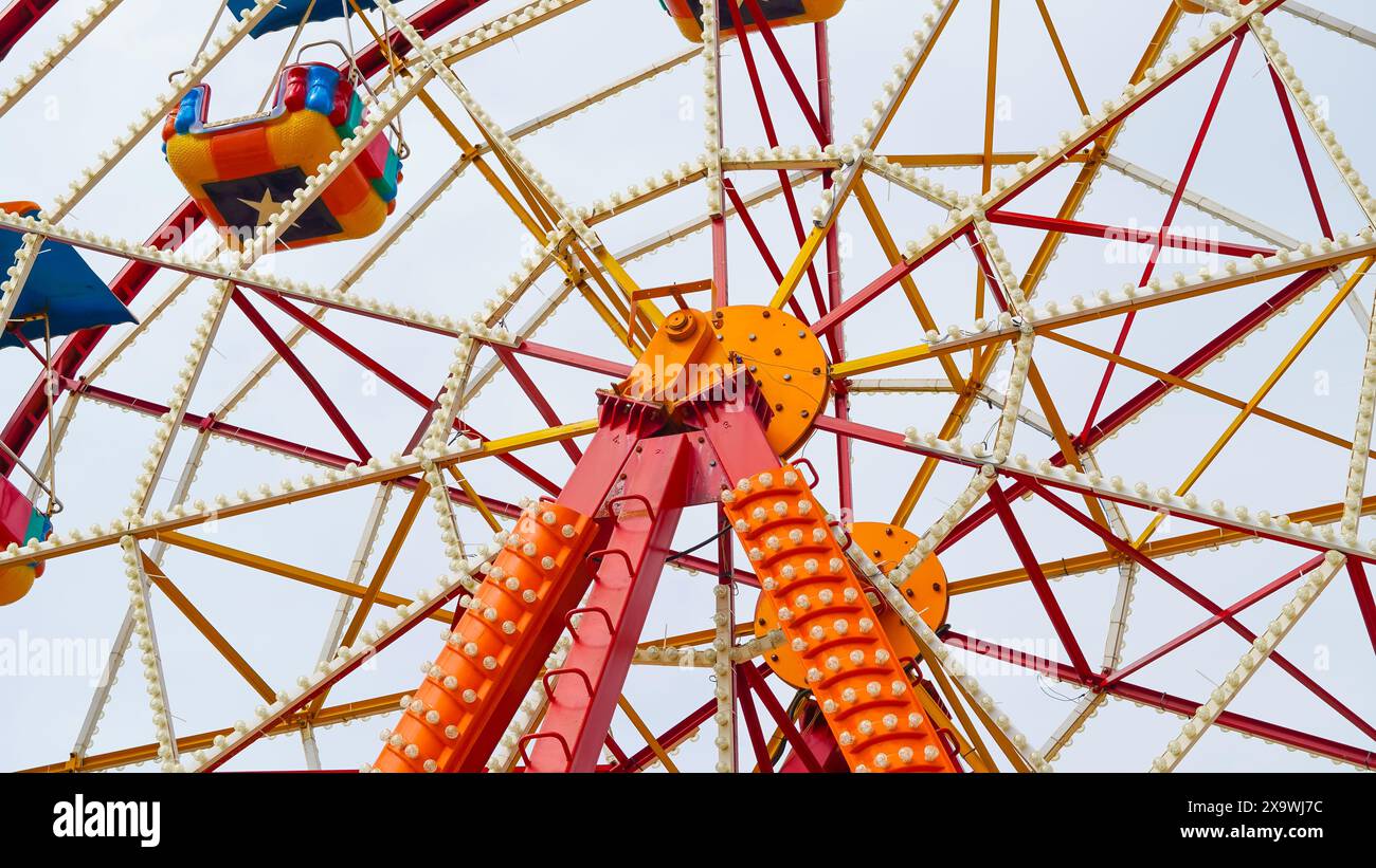 Ferris wheel in an amusement park, bright and fun, perfect for a sunny ...