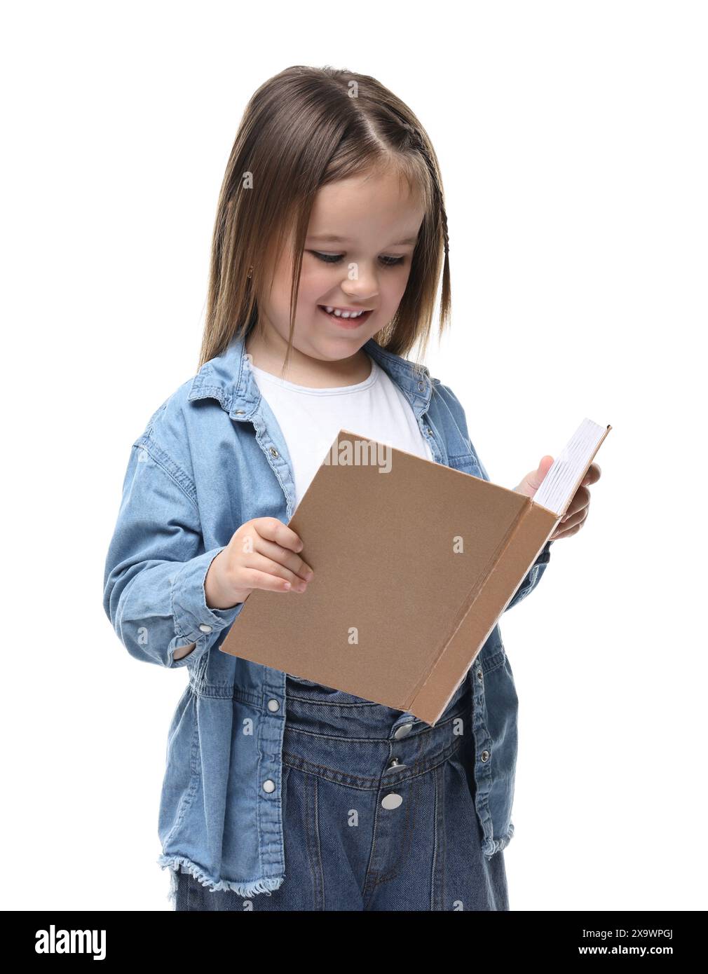 Cute little girl reading book on white background Stock Photo - Alamy