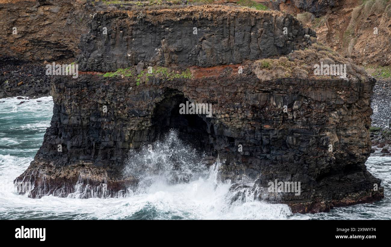 Roque Chico sea arch, an excellent example of coastal erosion by wave action from Rambla de Castro walking path near Puerto de la Cruz, Tenerife Stock Photo