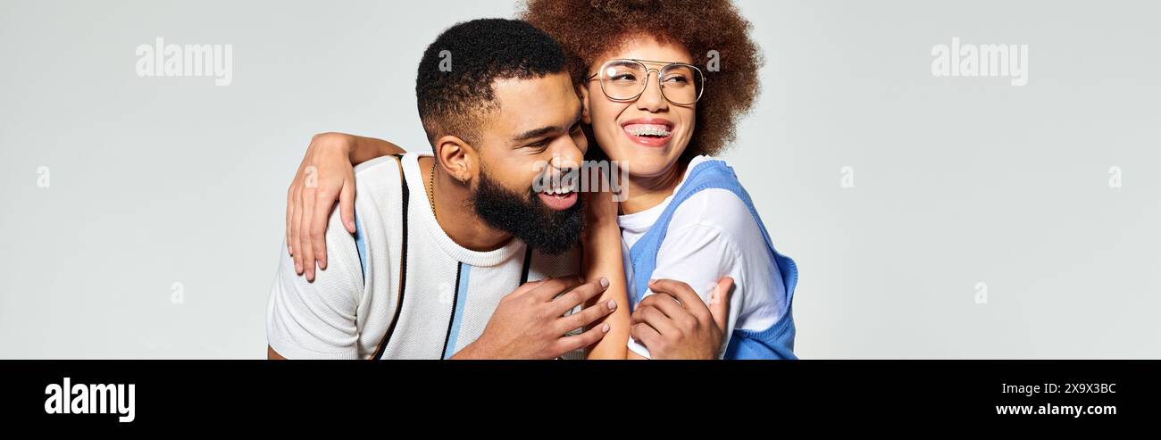 Two stylishly dressed African American friends embracing each other ...