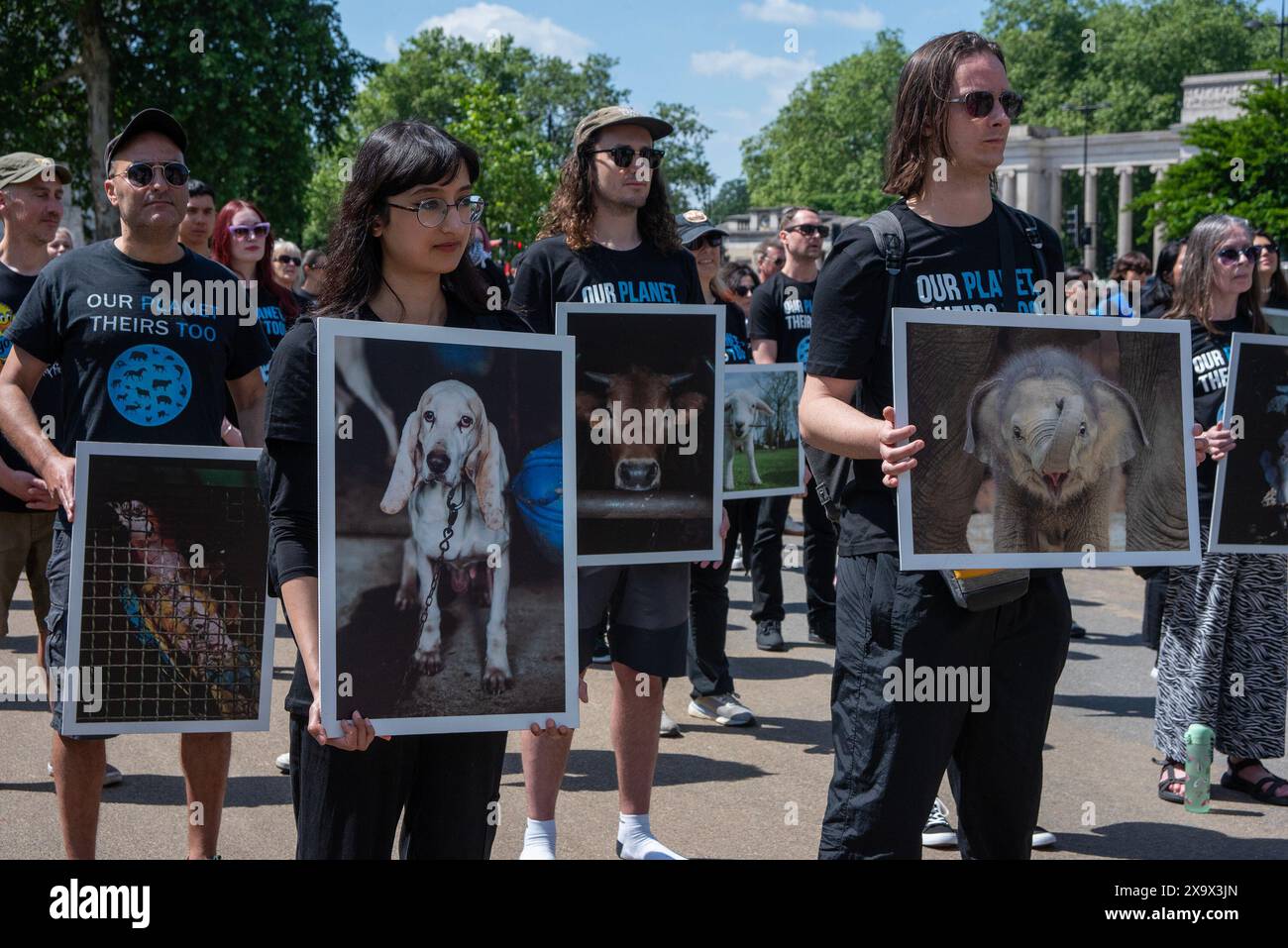 Activists hold placards during the commemoration. The National Animal ...
