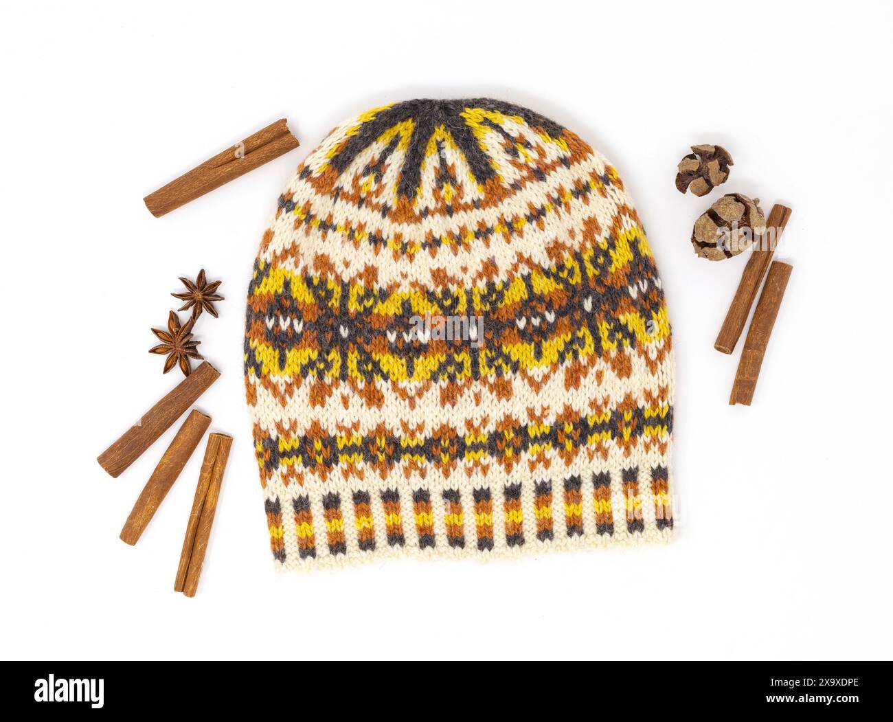 Flat lay photography of a fair Isle tweed wool knitted hat in white