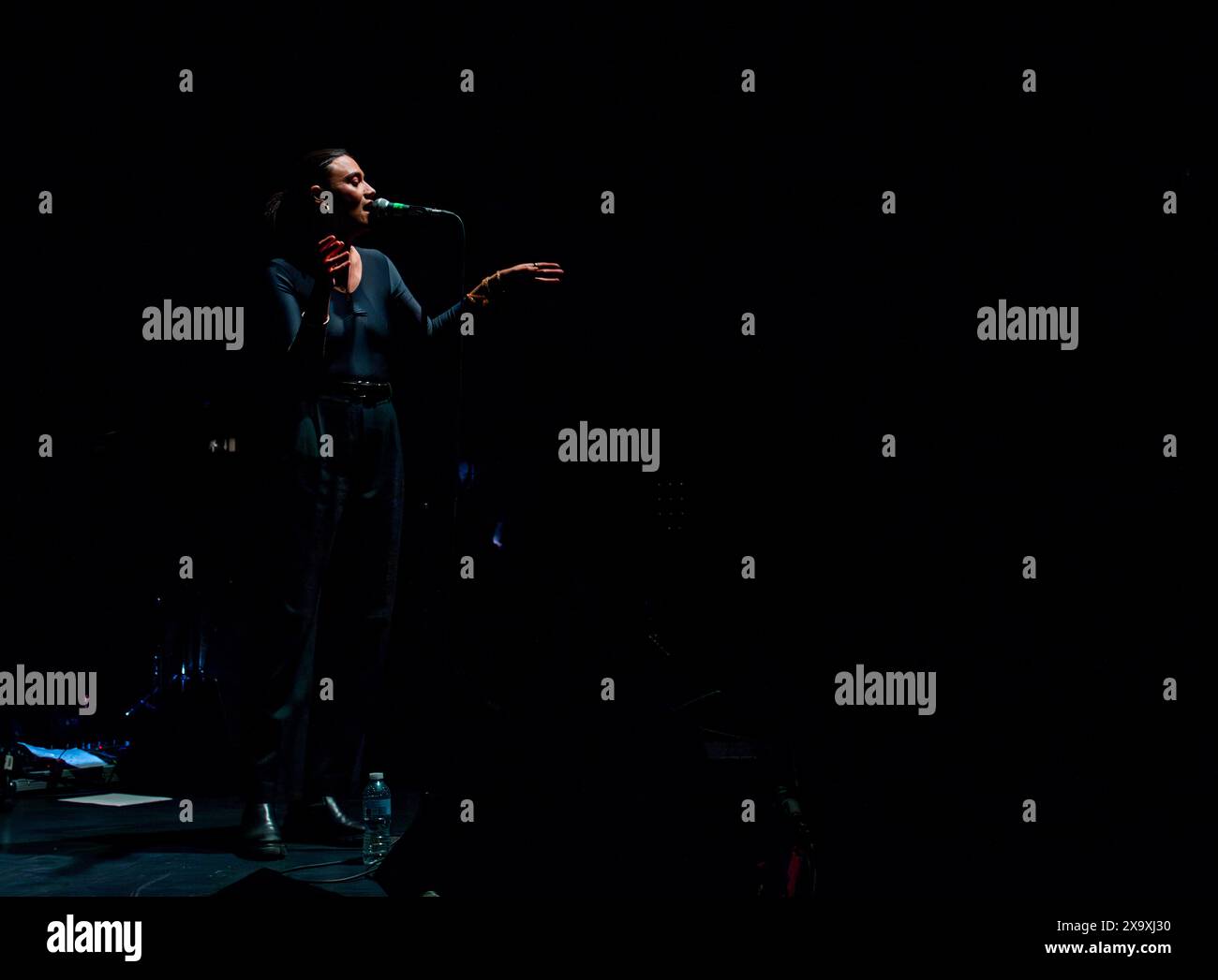 British singer and songwriter Nadine Shah playing live at the Hammersmith Apollo as supporting act for Young Fathers. Stock Photo