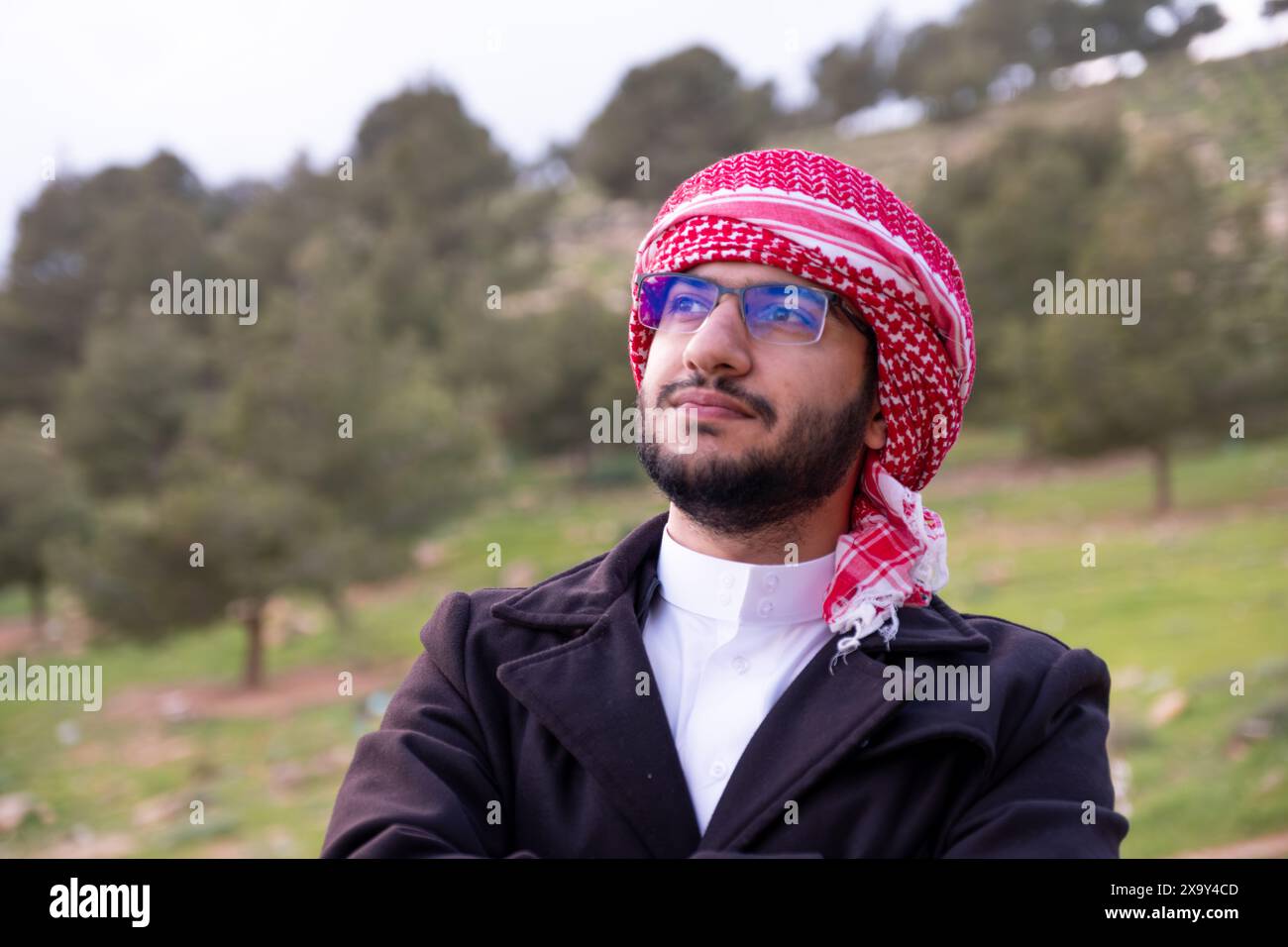 Arab Man Tree An Arab man in nature clears his mind and thinks positively about the ...