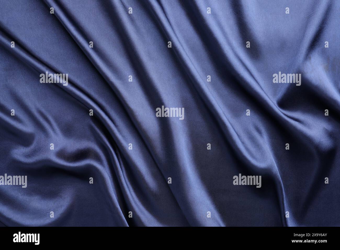 Crumpled dark blue silk fabric as background, top view Stock Photo - Alamy