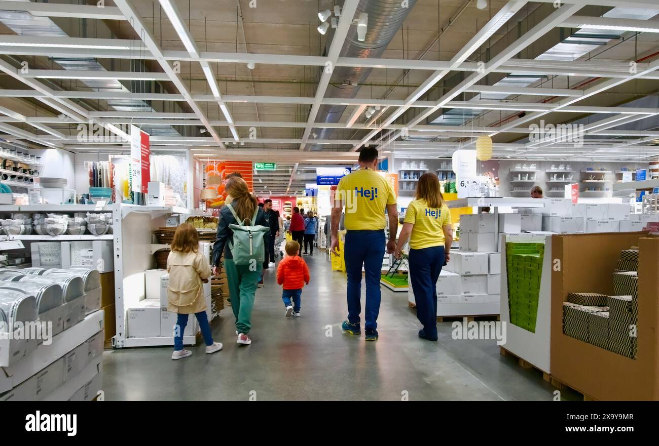 interior of the IKEA store with workers and people walking through an ...