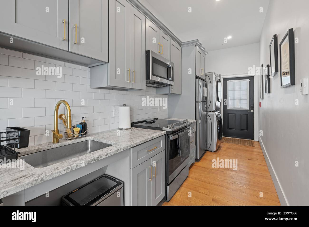 A modern empty kitchen available for rent and ready for use. Stock Photo