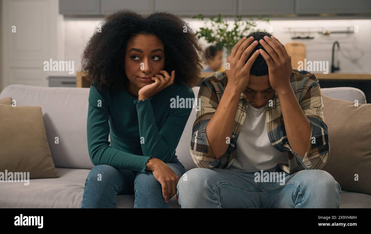 African American ethnic family sad parents father suffering headache ...