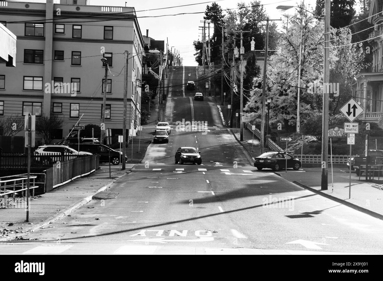 Monochrome image of road with cars in motion Stock Photo - Alamy